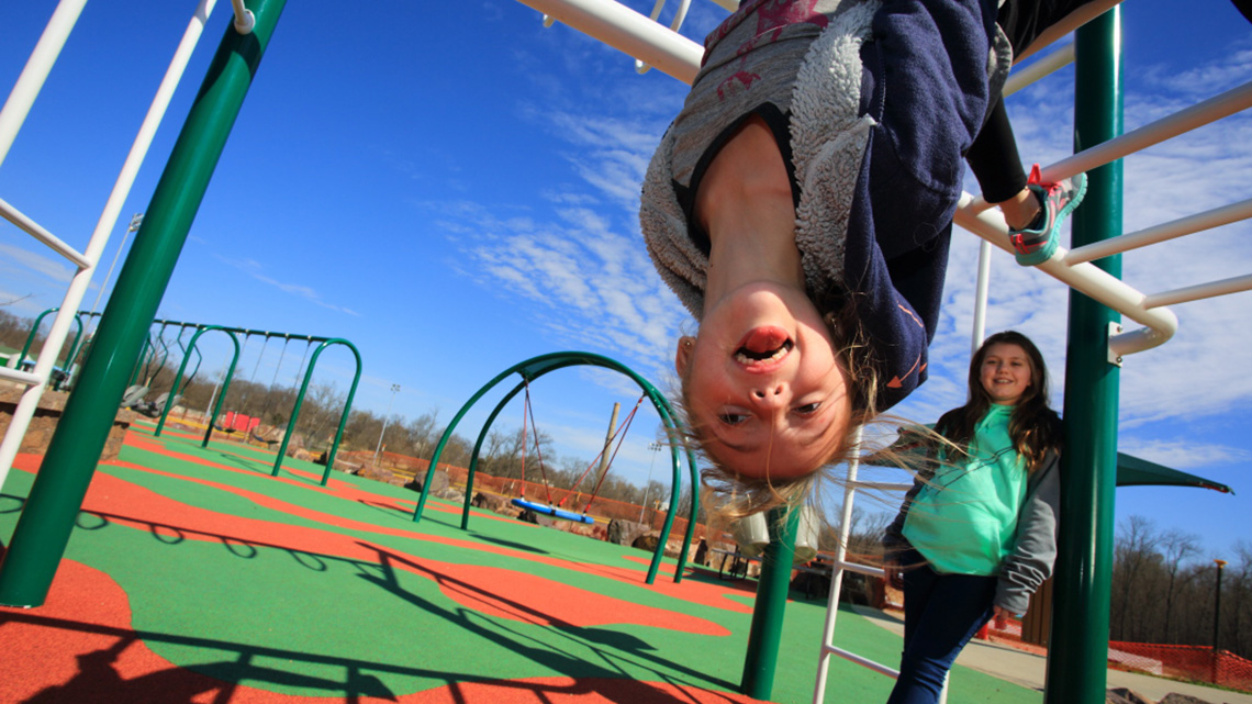 Young girls playing at all-abilities Kade’s Playground in Herculaneum, Missouri.